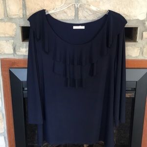 Blouse with ruffle front.